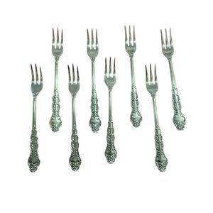 Sophisticated Silver Flatware Set with Intricate Design